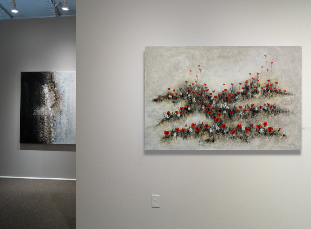 Scarlet Ribbons by Charles H. Reinike III hanging in the gallery